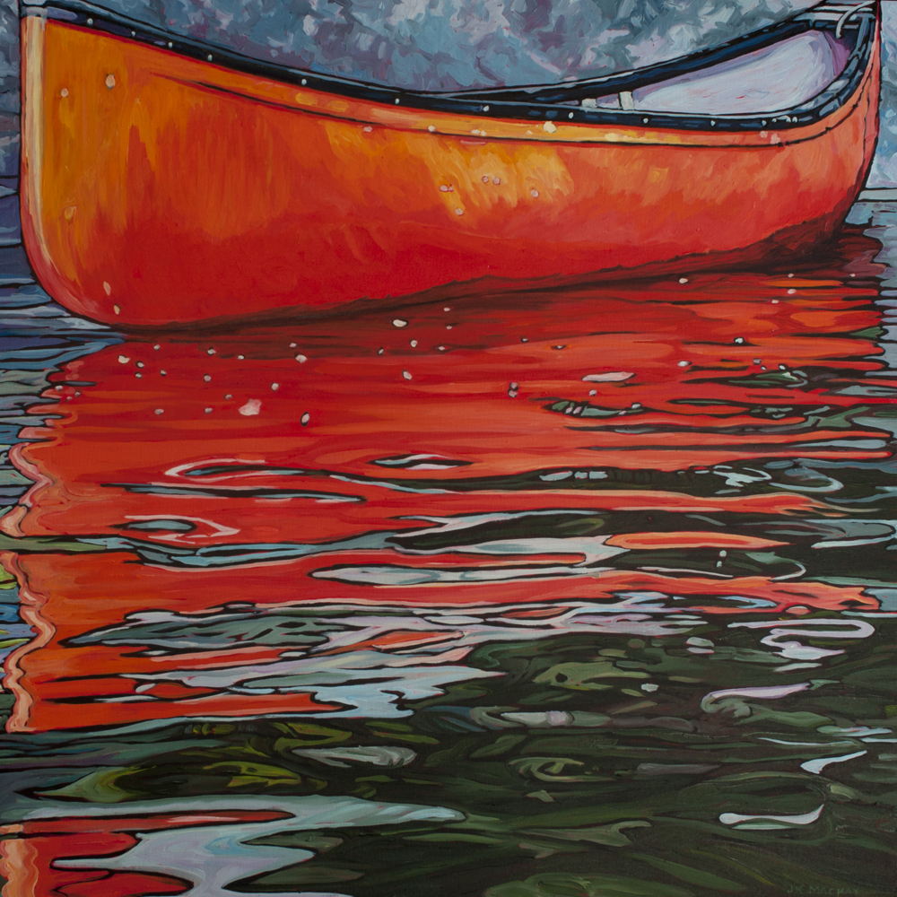 Red Canoe along rocky shore reflected